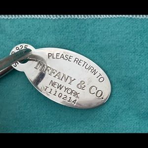 Please return to Tiffany and co key chain & charm